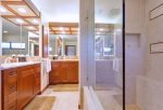 Enjoy two vanities and large walk-in shower